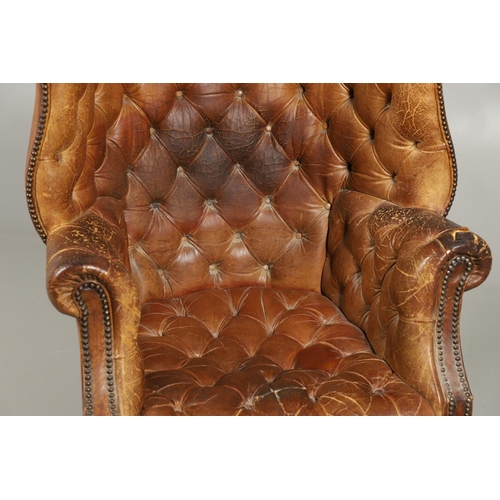 1233 - A GEORGE III STYLE LEATHER WINGBACK ARMCHAIR. with high back, serpentine seat and scroll arms, the b... 