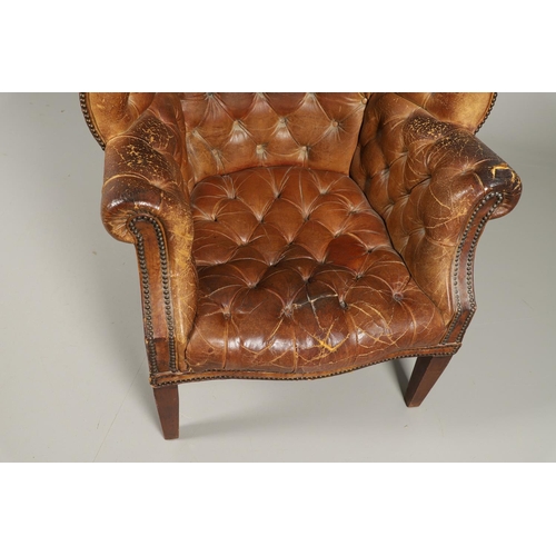 1233 - A GEORGE III STYLE LEATHER WINGBACK ARMCHAIR. with high back, serpentine seat and scroll arms, the b... 