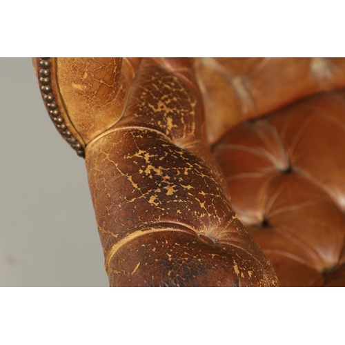 1233 - A GEORGE III STYLE LEATHER WINGBACK ARMCHAIR. with high back, serpentine seat and scroll arms, the b... 