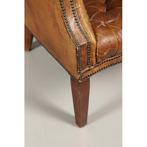 1233 - A GEORGE III STYLE LEATHER WINGBACK ARMCHAIR. with high back, serpentine seat and scroll arms, the b... 