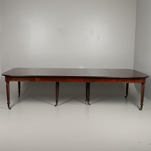 1238 - A REGENCY MAHOGANY EXTENDING DINING TABLE. the rectangular top with a reeded edge and concertina act... 