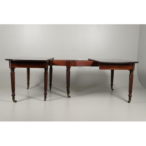 1238 - A REGENCY MAHOGANY EXTENDING DINING TABLE. the rectangular top with a reeded edge and concertina act... 