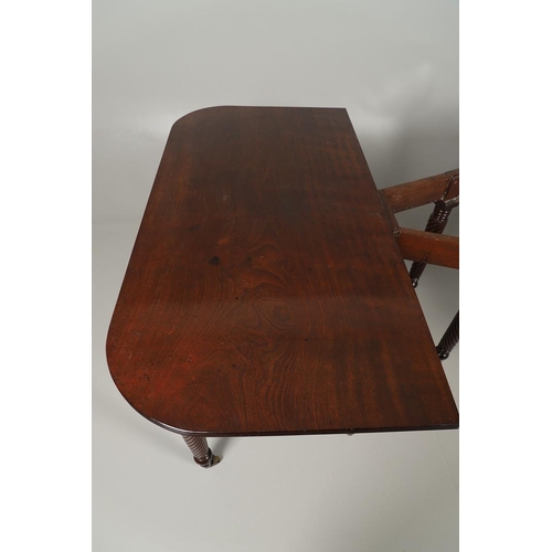 1238 - A REGENCY MAHOGANY EXTENDING DINING TABLE. the rectangular top with a reeded edge and concertina act... 