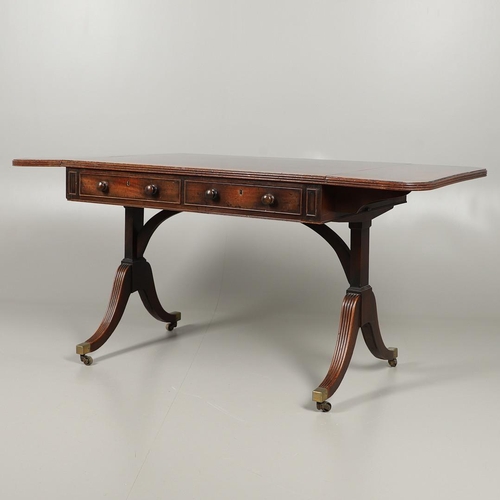 1242 - A REGENCY MAHOGANY AND ROSEWOOD BANDED SOFA TABLE IN THE MANNER OF GILLOWS. the rosewood banded and ... 