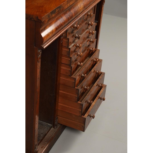 1244 - A 19TH CENTURY WALNUT WELLINGTON CHEST BOOKCASE. the open shelved top section with carved scrolling ... 