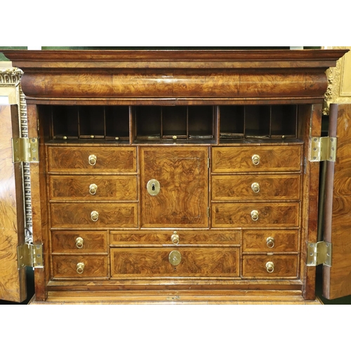 1251 - AN EARLY 18TH CENTURY WALNUT ESTATE CUPBOARD. the cushion cornice with unusual hinged lockable front... 