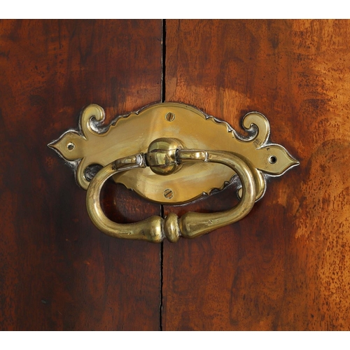 1251 - AN EARLY 18TH CENTURY WALNUT ESTATE CUPBOARD. the cushion cornice with unusual hinged lockable front... 