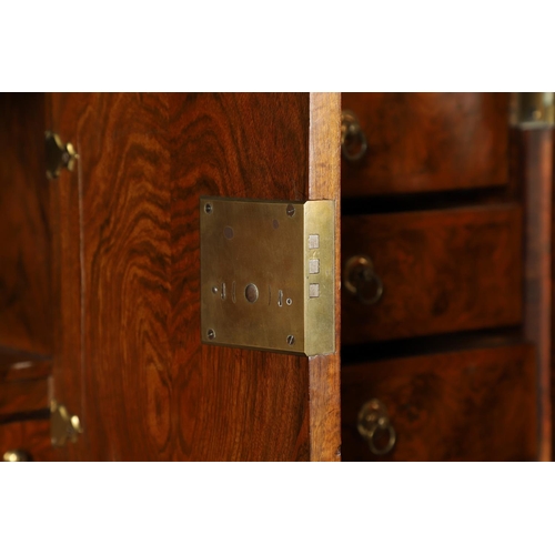 1251 - AN EARLY 18TH CENTURY WALNUT ESTATE CUPBOARD. the cushion cornice with unusual hinged lockable front... 