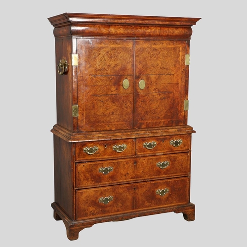 1251 - AN EARLY 18TH CENTURY WALNUT ESTATE CUPBOARD. the cushion cornice with unusual hinged lockable front... 