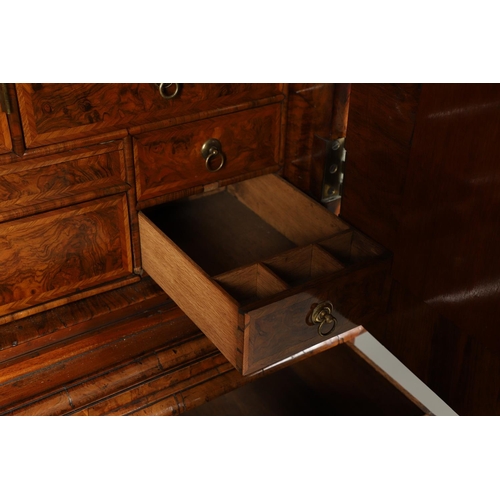 1251 - AN EARLY 18TH CENTURY WALNUT ESTATE CUPBOARD. the cushion cornice with unusual hinged lockable front... 