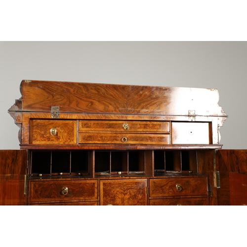 1251 - AN EARLY 18TH CENTURY WALNUT ESTATE CUPBOARD. the cushion cornice with unusual hinged lockable front... 