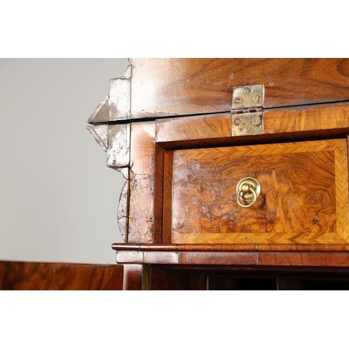 1251 - AN EARLY 18TH CENTURY WALNUT ESTATE CUPBOARD. the cushion cornice with unusual hinged lockable front... 