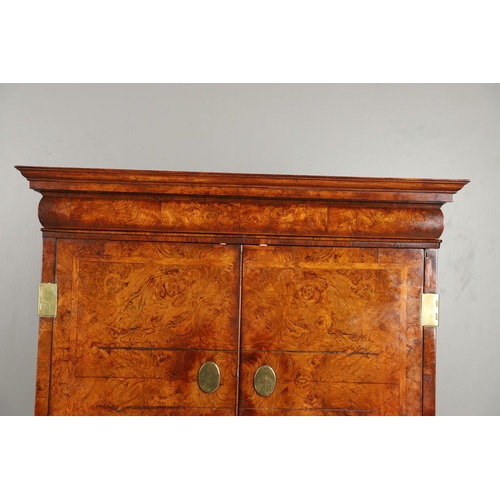 1251 - AN EARLY 18TH CENTURY WALNUT ESTATE CUPBOARD. the cushion cornice with unusual hinged lockable front... 