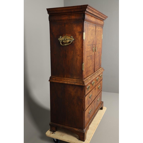 1251 - AN EARLY 18TH CENTURY WALNUT ESTATE CUPBOARD. the cushion cornice with unusual hinged lockable front... 