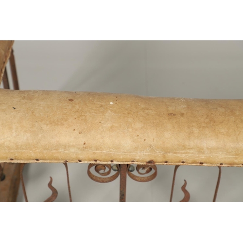 1252 - A 19TH CENTURY LEATHER AND WROUGHT IRON CLUB FENDER. the pale green leather seat over an ornate wrou... 