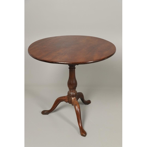 1254 - A GEORGE III MAHOGANY TRIPOD TABLE. the circular top with tilt top action upon a birdcage support, t... 