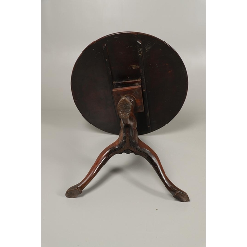 1254 - A GEORGE III MAHOGANY TRIPOD TABLE. the circular top with tilt top action upon a birdcage support, t... 