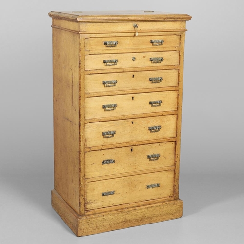 1255 - A LATE VICTORIAN OAK WELLINGTON STYLE CHEST OF DRAWERS. the hinged top opening to reveal sectional s... 