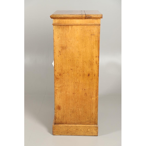 1255 - A LATE VICTORIAN OAK WELLINGTON STYLE CHEST OF DRAWERS. the hinged top opening to reveal sectional s... 