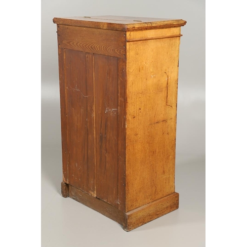 1255 - A LATE VICTORIAN OAK WELLINGTON STYLE CHEST OF DRAWERS. the hinged top opening to reveal sectional s... 