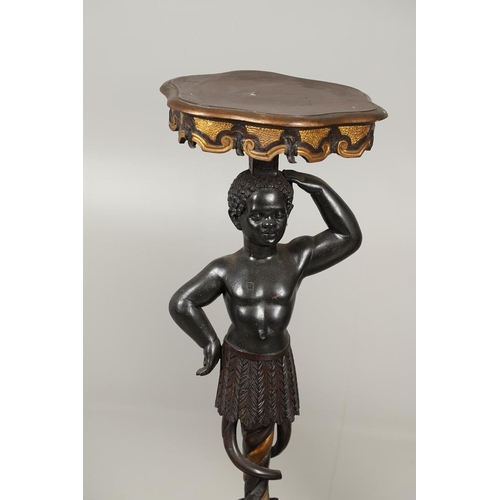 1256 - A PAIR OF PAINTED BLACKAMOOR TORCHERE STANDS. each carved figure holding aloft a shaped stand upon s... 