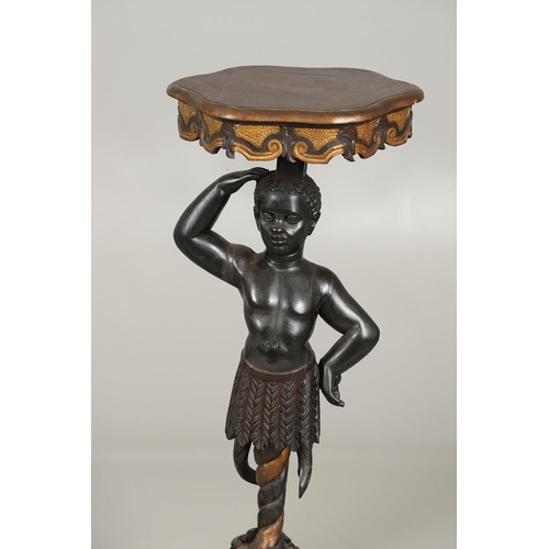 1256 - A PAIR OF PAINTED BLACKAMOOR TORCHERE STANDS. each carved figure holding aloft a shaped stand upon s... 