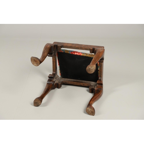 1260 - A GEORGE II WALNUT FOOTSTOOL. the rectangular frame upon scroll carved cabriole legs and spade feet,... 