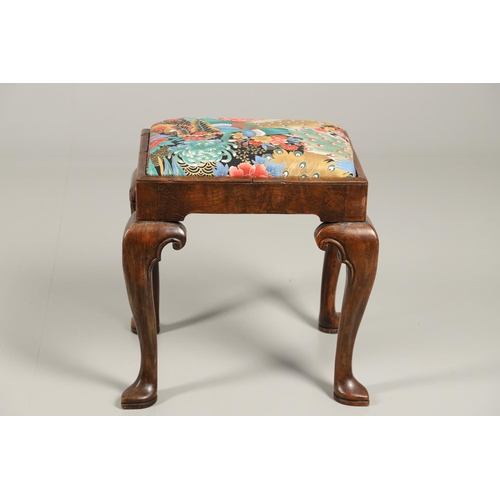 1260 - A GEORGE II WALNUT FOOTSTOOL. the rectangular frame upon scroll carved cabriole legs and spade feet,... 