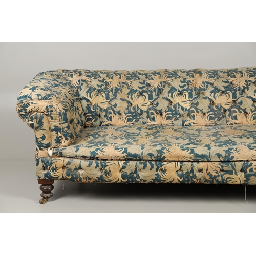 1262 - A 19TH CENTURY CHESTERFIELD SOFA. button backed with low, scrolling back and arms on turned mahogany... 