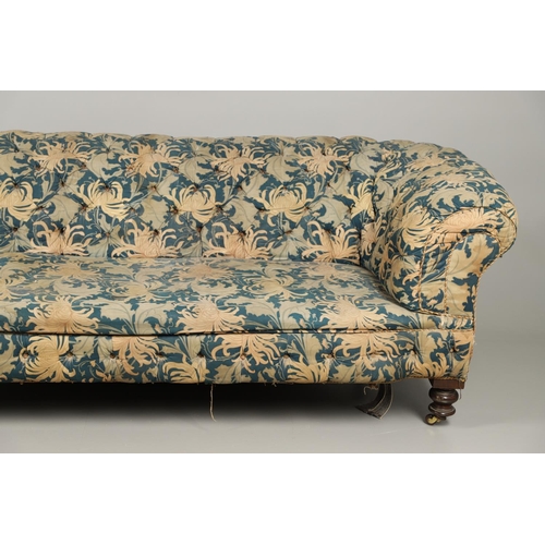 1262 - A 19TH CENTURY CHESTERFIELD SOFA. button backed with low, scrolling back and arms on turned mahogany... 