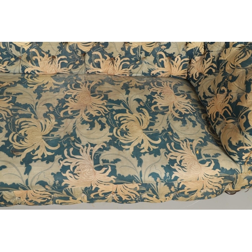 1262 - A 19TH CENTURY CHESTERFIELD SOFA. button backed with low, scrolling back and arms on turned mahogany... 