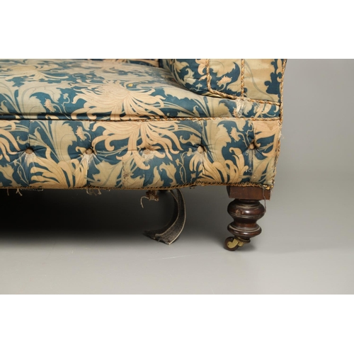 1262 - A 19TH CENTURY CHESTERFIELD SOFA. button backed with low, scrolling back and arms on turned mahogany... 