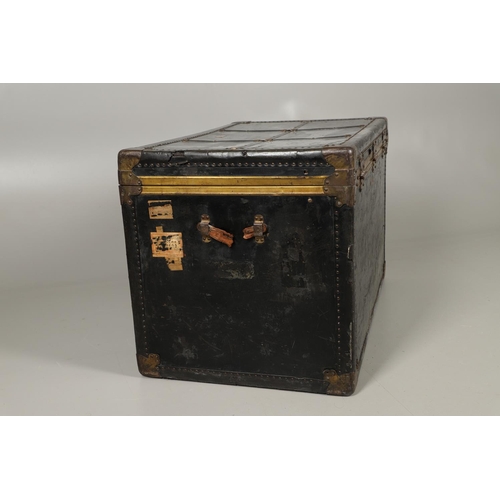 1263 - AN EARLY 20TH CENTURY BRASS BOUND LEATHER STEAMER TRUNK. with retailer's label for Trunk & Bag Co Lo... 