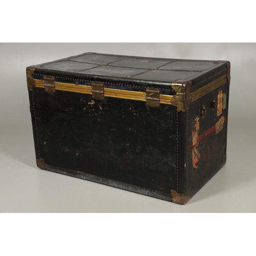 1263 - AN EARLY 20TH CENTURY BRASS BOUND LEATHER STEAMER TRUNK. with retailer's label for Trunk & Bag Co Lo... 