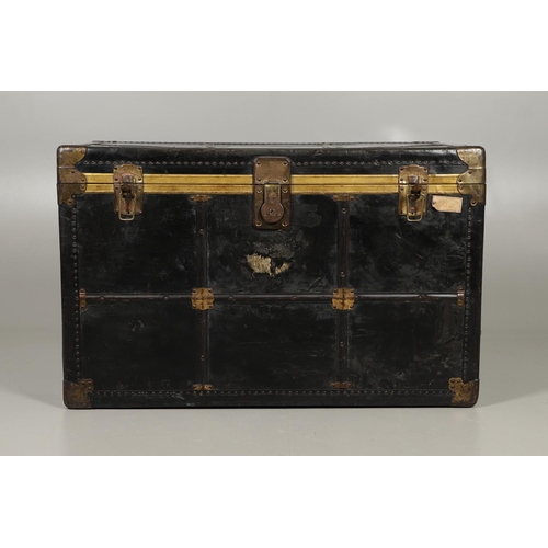 1263 - AN EARLY 20TH CENTURY BRASS BOUND LEATHER STEAMER TRUNK. with retailer's label for Trunk & Bag Co Lo... 