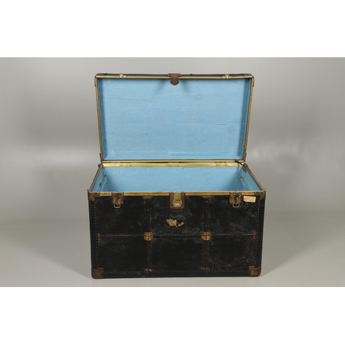 1263 - AN EARLY 20TH CENTURY BRASS BOUND LEATHER STEAMER TRUNK. with retailer's label for Trunk & Bag Co Lo... 