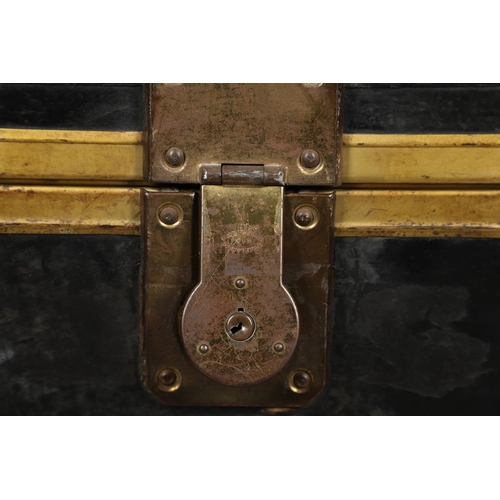 1263 - AN EARLY 20TH CENTURY BRASS BOUND LEATHER STEAMER TRUNK. with retailer's label for Trunk & Bag Co Lo... 