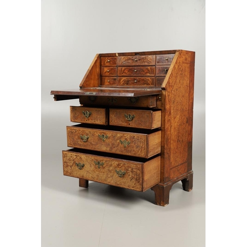 1264 - AN 18TH CENTURY WALNUT BUREAU. of small proportions with feathered crossbanding, the fall front encl... 