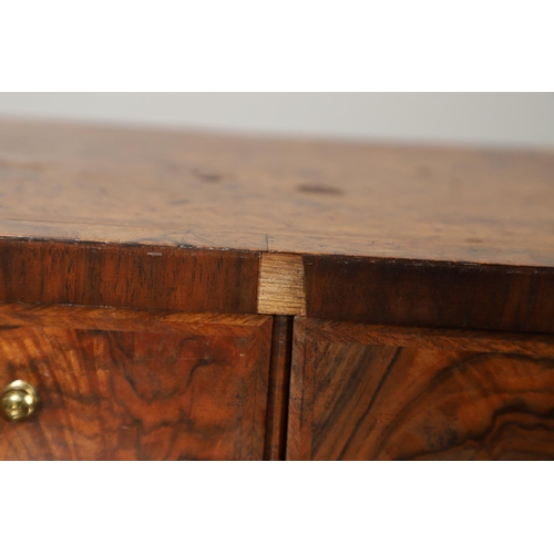 1264 - AN 18TH CENTURY WALNUT BUREAU. of small proportions with feathered crossbanding, the fall front encl... 