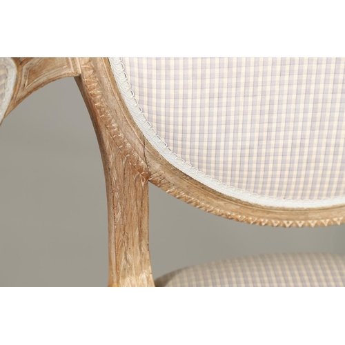 1265 - A PAIR OF SHERATON STYLE LIMEWOOD ELBOW CHAIRS. the shield backs on scroll arms, serpentine seat and... 