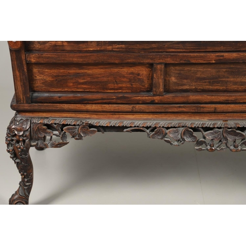 1267 - A CHINESE CARVED HARDWOOD HALL SEAT, QING DYNASTY, 19TH CENTURY. the shaped back with pierced triple... 