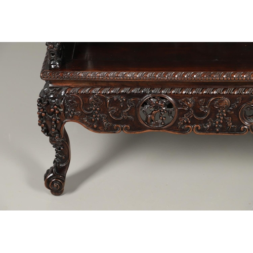 1267 - A CHINESE CARVED HARDWOOD HALL SEAT, QING DYNASTY, 19TH CENTURY. the shaped back with pierced triple... 