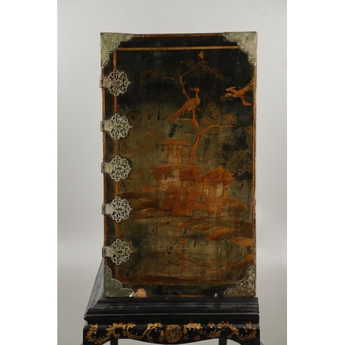 1268 - A CHINESE BLACK LACQUERED EXPORT CABINET. brass mounted, the cupboard doors and sides decorated with... 