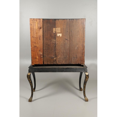 1268 - A CHINESE BLACK LACQUERED EXPORT CABINET. brass mounted, the cupboard doors and sides decorated with... 