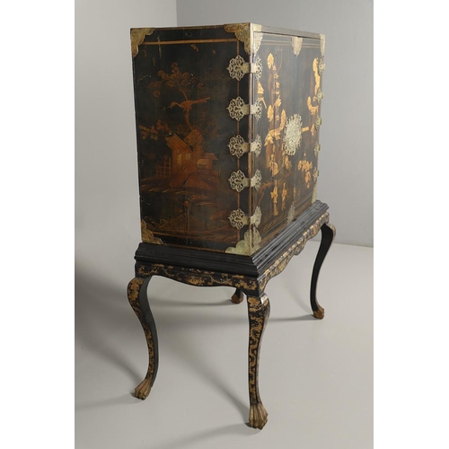 1268 - A CHINESE BLACK LACQUERED EXPORT CABINET. brass mounted, the cupboard doors and sides decorated with... 