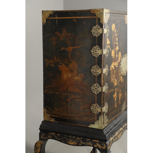 1268 - A CHINESE BLACK LACQUERED EXPORT CABINET. brass mounted, the cupboard doors and sides decorated with... 