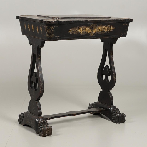 1269 - A CHINESE EXPORT LACQUERED WORK TABLE. the shaped lid with gilt Chinoiserie decoration of figures in... 