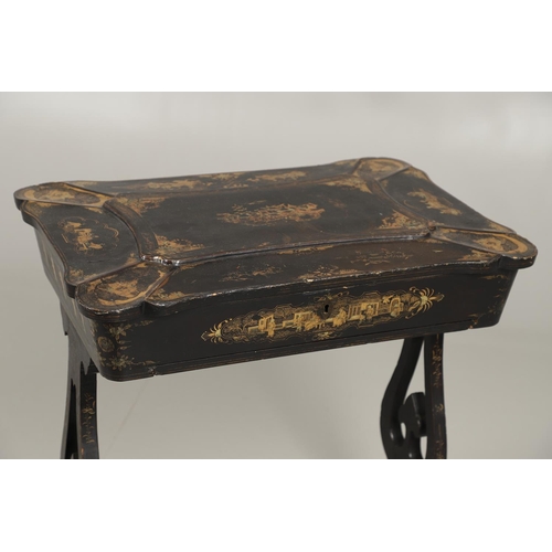 1269 - A CHINESE EXPORT LACQUERED WORK TABLE. the shaped lid with gilt Chinoiserie decoration of figures in... 