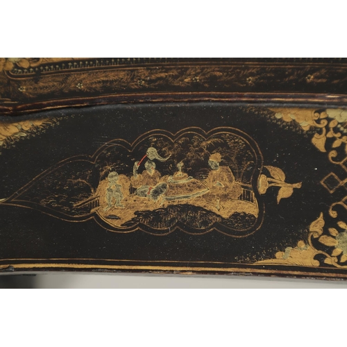 1269 - A CHINESE EXPORT LACQUERED WORK TABLE. the shaped lid with gilt Chinoiserie decoration of figures in... 