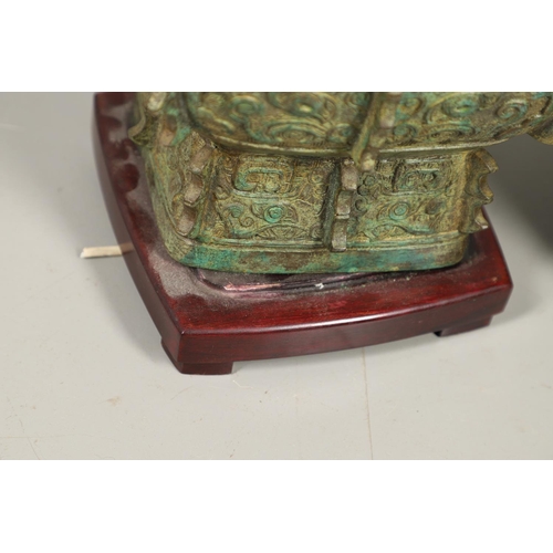 1271 - A PAIR OF CHINESE STYLE ARCHAIC BRONZE TABLE LAMPS. 20th century, with green painted 'patinated' fin... 